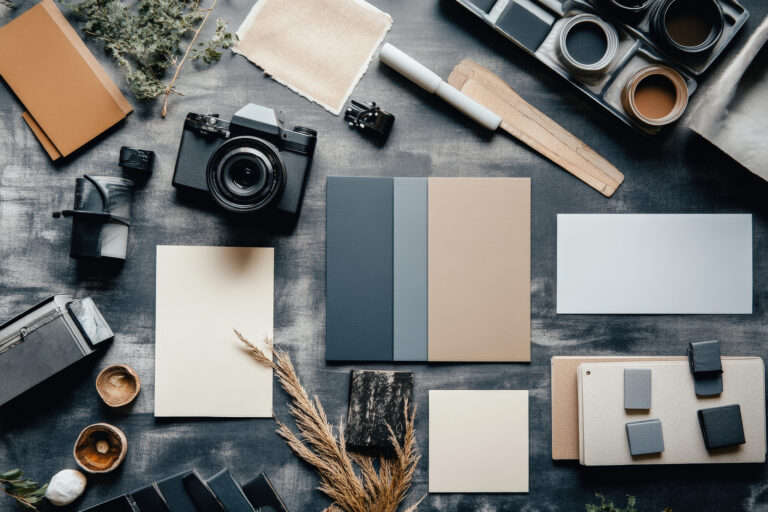 A clean flat lay of graphic design tools and branding elements